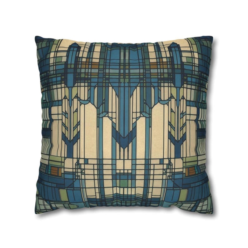May include: A square throw pillow featuring a geometric pattern of intersecting lines and rectangles in shades of deep blue, light blue, cream, and muted green. The design creates a symmetrical, grid-like composition across the entire surface.