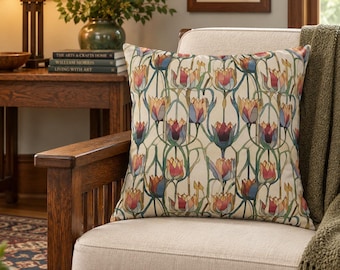 May include: A square throw pillow featuring a repeating pattern of stylized tulips in shades of red, orange, yellow, and blue on a cream background. The floral design includes long, slender green stems and leaves that create a continuous vertical motif.