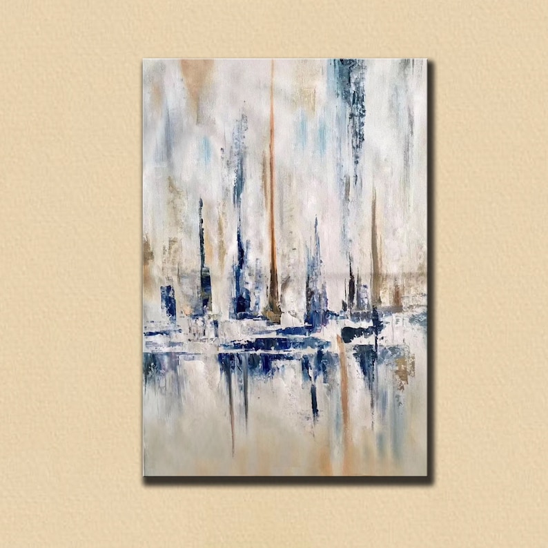 May include: Abstract oil painting on canvas featuring vertical brushstrokes in shades of white, blue, and brown. The artwork has a reflective quality, with the colors mirroring at the bottom of the canvas. The overall theme is a modern, minimalist landscape.