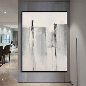 May include: Abstract painting with gray and white vertical stripes and blocks. The painting has a minimalist style and is framed in black.