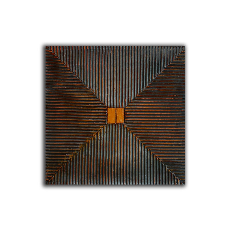 May include: A square wooden wall art piece with a geometric design. The piece is made of dark wood with a light brown square in the center.