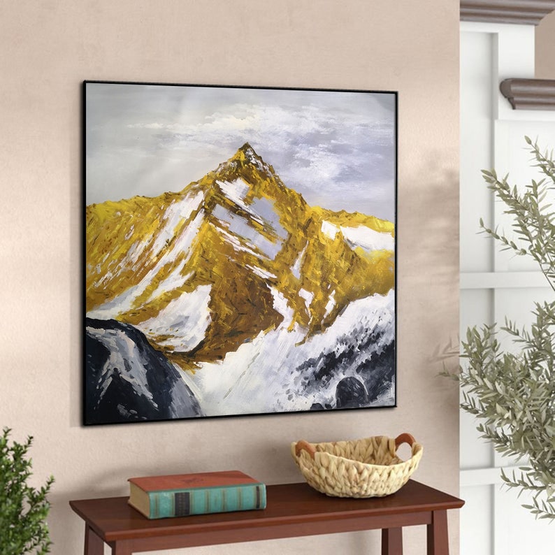 May include: Abstract painting of a snow-capped mountain range with a golden peak. The painting is done in shades of white, grey, and gold.