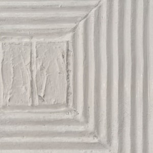 May include: A white textured square with a smaller white textured square inside. The outer square has a series of horizontal lines.