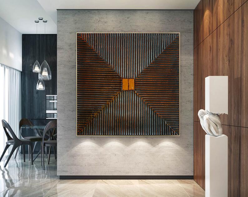 May include: Abstract geometric wall art with a dark brown and orange color scheme. The artwork features a series of intersecting lines creating a diamond shape in the center.
