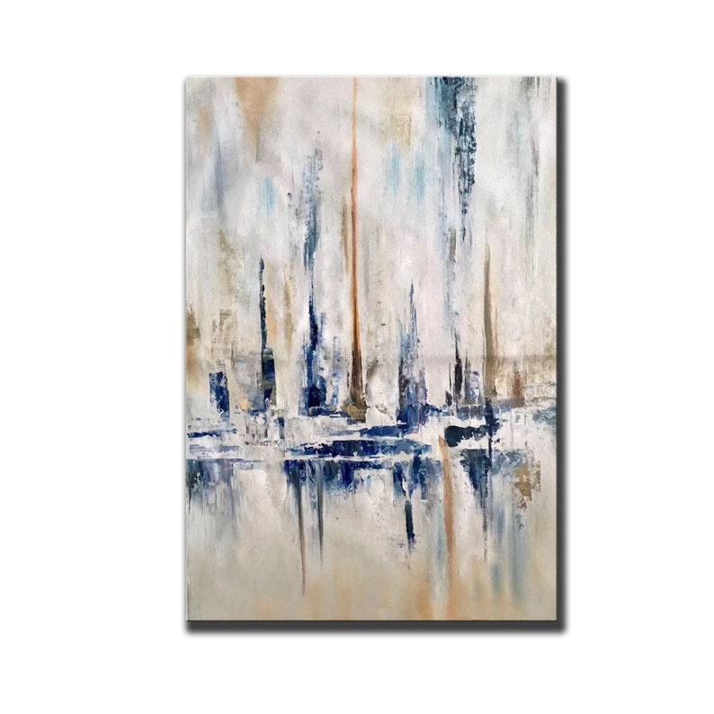 May include: Abstract oil painting on canvas featuring vertical brushstrokes in shades of white, beige, blue, and brown. The artwork has a textured appearance, with a reflective effect at the bottom, creating a sense of depth and movement.