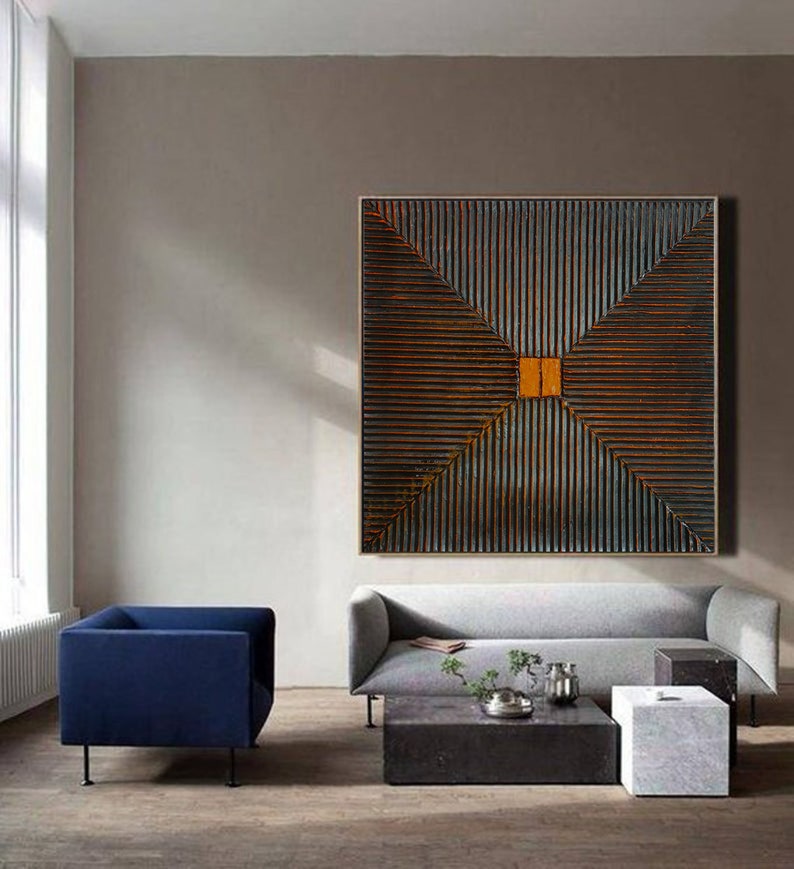 May include: Abstract geometric wall art with a dark brown and orange color scheme. The artwork features a series of intersecting lines creating a diamond shape in the center.