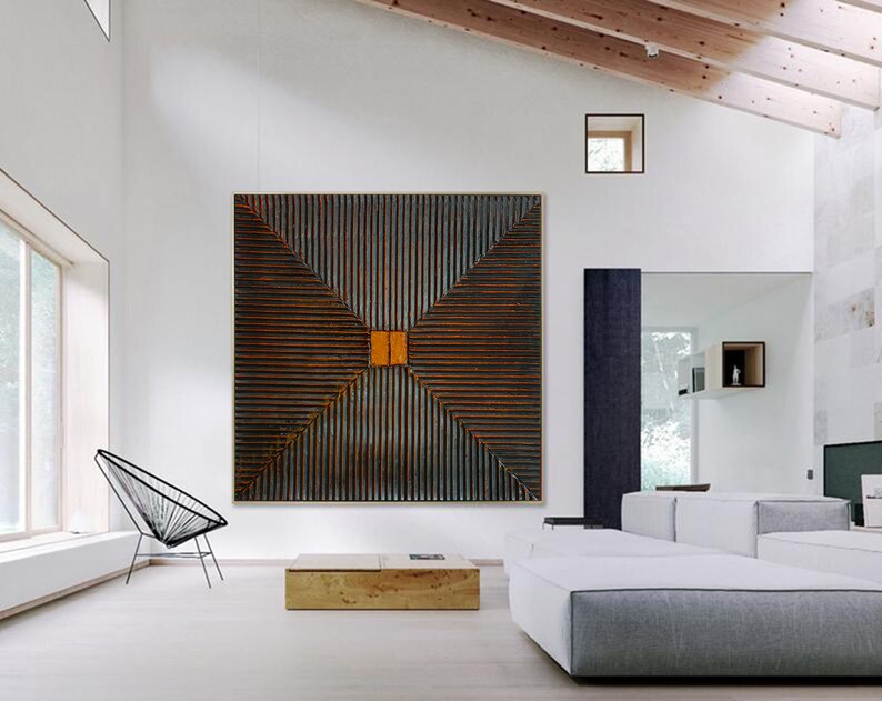 May include: A large abstract wall art piece with a geometric design. The artwork is made of wood and has a dark brown and orange color scheme.