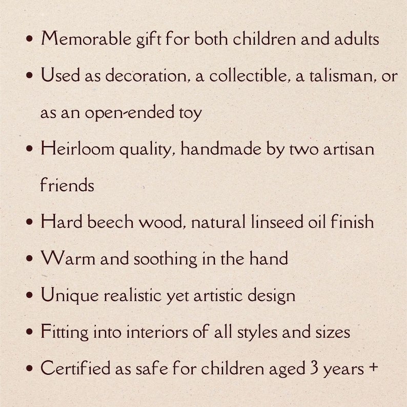 May include: Text on a cream-colored background lists features of a product. The text includes: a memorable gift for children and adults, used as decoration, heirloom quality, hard beech wood, warm and soothing, unique design, and safe for children aged 3+.