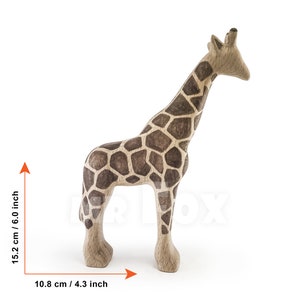 May include: A wooden giraffe figurine with a brown and black patterned design. The giraffe is 6 inches tall and 4.3 inches wide.