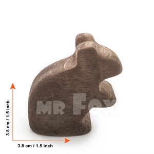 wooden field mouse against white background side view