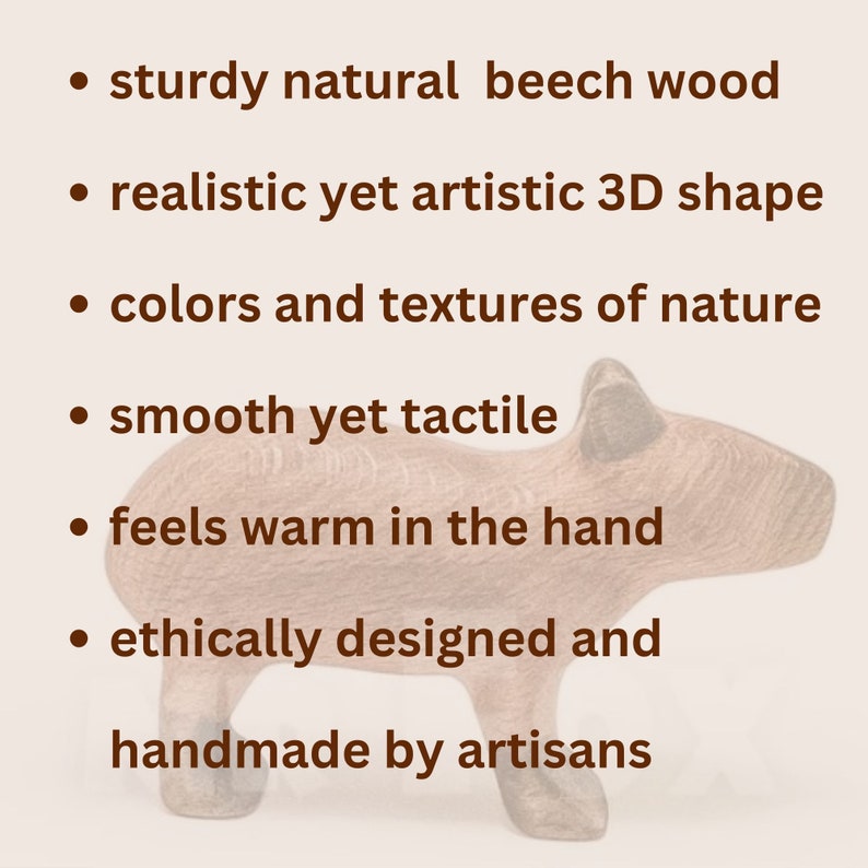 May include: A wooden animal sculpture, possibly a capybara, made from natural beech wood. The sculpture has a 3D shape and a smooth, tactile surface. The image text states it is ethically designed and handmade by artisans.