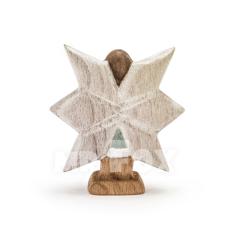 Wooden winter fairy figurine. Back view. White background. Blue dress. White showflake shaped wings. Long dark brown hair.
