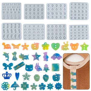 May include: Set of 6 silicone moulds for making resin buttons. The moulds feature various shapes, including stars, hearts, flowers, animals, and geometric shapes. The moulds are shown with finished resin buttons in a variety of colours.