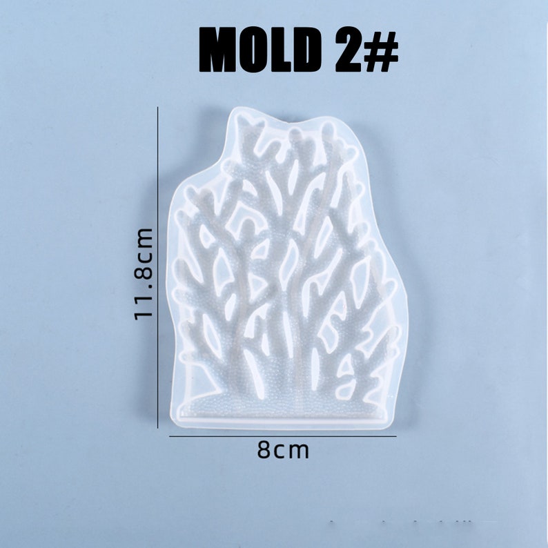 Puede incluir: Molde de silicona transparente con forma de coral, de 11,8 cm de alto y 8 cm de ancho. El molde est&aacute; etiquetado como "MOLD 2#" en negro. Ideal para fundici&oacute;n de resina y manualidades.