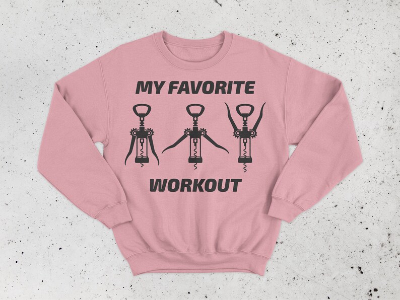 May include: Pink sweatshirt with the text "MY FAVORITE WORKOUT" and three black silhouettes of corkscrews.