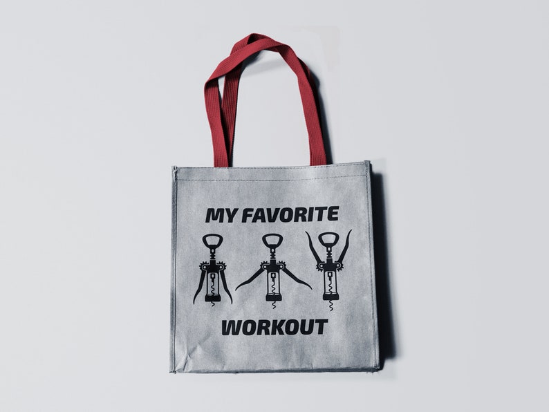 May include: A gray reusable tote bag with red handles. The bag has a black graphic of three corkscrews with the text "MY FAVORITE WORKOUT" printed on it.