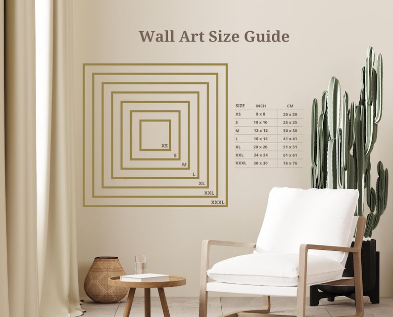 The image is a wall art size guide, showing the dimensions of various wall art pieces in a room with a white chair, a potted plant, and a wooden table.