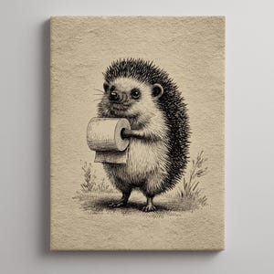 May include: A white ceramic mug with a black handle and the text "But First, Coffee" in a bold, black font. The mug is set against a blurred background, suggesting a cozy setting.