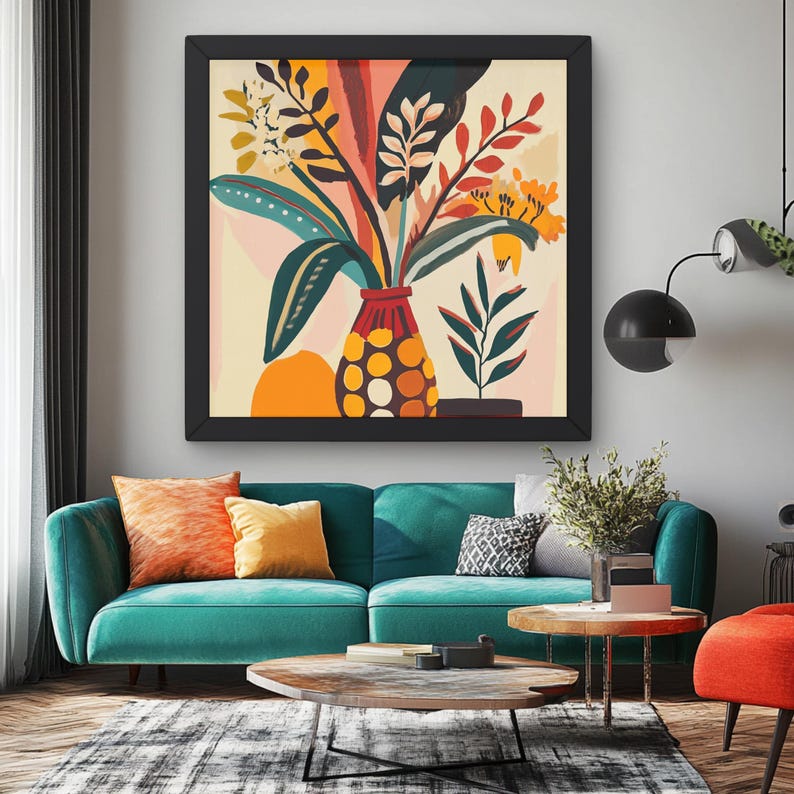 May include: A framed abstract painting of a vase with colorful flowers and leaves. The vase is red and white with polka dots and the flowers are yellow, orange, red, and green. The painting is hanging on a wall above a teal blue sofa with orange and yellow throw pillows.