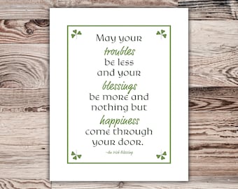 May include: A white card with a green shamrock design and an Irish blessing that reads: "May your troubles be less and your blessings be more and nothing but happiness come through your door. -An Irish Blessing"