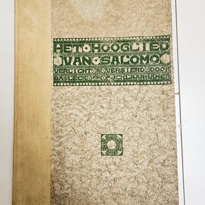 May include: A hardcover book with a textured beige cover and a smooth light tan spine. The front cover features green printed text reading HET HOOGLIED VAN SALOMO VERLICHT OVERSTERD DOOR BABLECKO EN OP JCKLAARHAMER and a small green circular emblem.