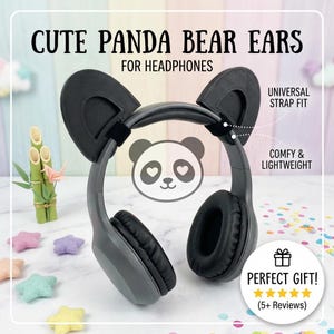 May include: Black panda bear ears designed to attach to headphones. The accessory features a universal strap fit and is lightweight. Text on the image reads CUTE PANDA BEAR EARS FOR HEADPHONES, UNIVERSAL STRAP FIT, COMFY & LIGHTWEIGHT, PERFECT GIFT, and 5+ Reviews.