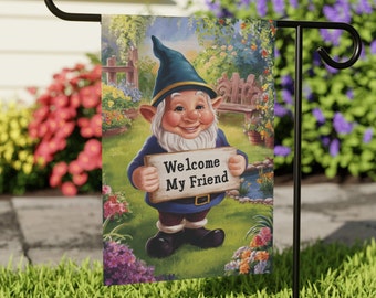 May include: A garden flag with a cartoon gnome holding a sign that says "Welcome My Friend". The gnome is wearing a blue hat and a blue shirt. The background is a garden scene with flowers and a pond.