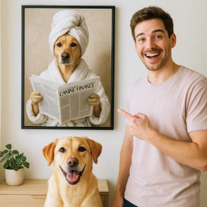 May include: A framed print of a dog wearing a white bathrobe and a towel on its head, reading a newspaper titled "Canine Finance". A person is standing next to the print, pointing at it with a smile. A yellow Labrador Retriever is sitting in front of the print.