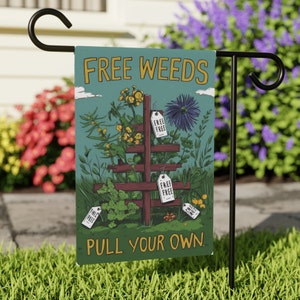 May include: A green garden flag with the text "FREE WEEDS PULL YOUR OWN" in white. The flag features a cartoon illustration of a wooden trellis with various types of weeds growing on it.  There are several tags hanging from the trellis that say "FREE" in white.