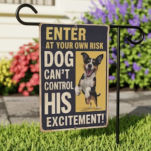 May include: A blue and yellow garden flag with a black and white dog jumping in the air. The flag reads "Enter at your own risk. Dog can't control his excitement!"