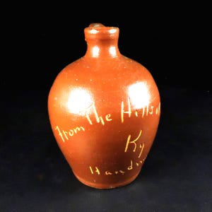 May include: A rustic wooden sign with the text "Welcome to our home" in white lettering. The sign has a distressed finish and a simple, inviting design, ideal for entryway decor.