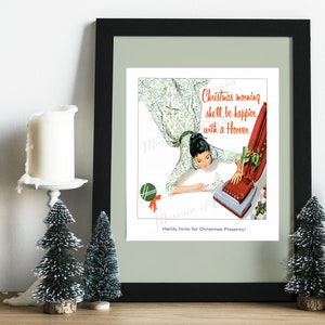 May include: A vintage advertisement for a Hoover vacuum cleaner. The ad features a woman in a floral dress, smiling as she looks at a red and silver Hoover vacuum cleaner. The text reads "Christmas morning she'll be happier with a Hoover. Handy hints for Christmas Presents!"