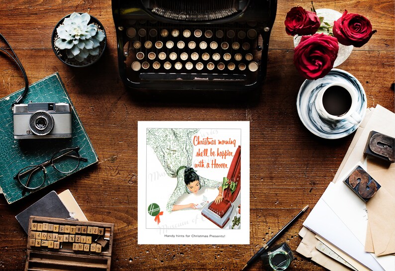 May include: A vintage advertisement for a Hoover vacuum cleaner. The ad features a woman in a white dress and a red bow, smiling as she uses the vacuum cleaner. The text reads "Christmas morning she'll be happier with a Hoover."  Handy hints for Christmas presents!