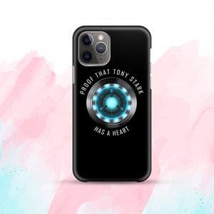May include: Black iPhone case featuring a blue and silver Iron Man arc reactor design. The text "Proof that Tony Stark has a heart" is printed on the case.