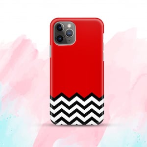 May include: Red phone case with a black and white chevron pattern at the bottom. The case has a cutout for the camera lens.