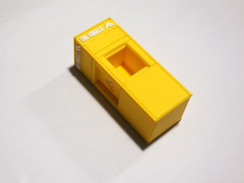 Cashboxes with a cashout station from the video game The Finals. Collectibles, Charms, Keychains, and cosplay items from "The Finals" FPS Video game
