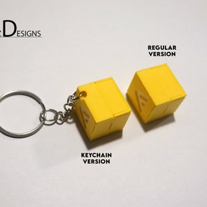 Cashboxes with a cashout station from the video game The Finals. Collectibles, Charms, Keychains, and cosplay items from "The Finals" FPS Video game