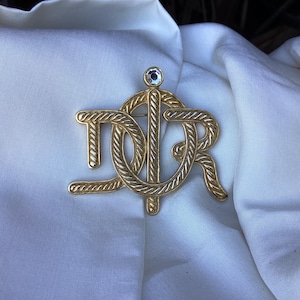 A super Dior monogram brooch/signed Christian Dior pin/authentic creator jewelry/gold tone and rhinestone clasp/French vintage accessories