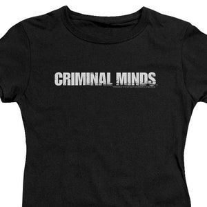 May include: Black t-shirt with the text "CRIMINAL MINDS" in white lettering.