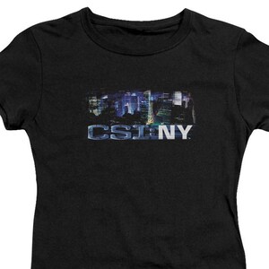 May include: Black women's t-shirt with a graphic of the New York City skyline and the text "CSI:NY".