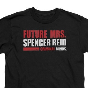 May include: Black t-shirt with white text that reads "Future Mrs. Spencer Reid" and "Criminal Minds" in red.