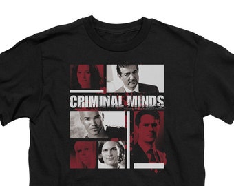 May include: Black t-shirt featuring a red and white graphic of the cast from the TV show "Criminal Minds".
