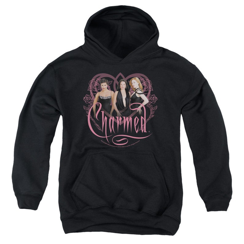 May include: Black hooded sweatshirt with a pink heart design featuring three women in black dresses and the text "Charmed" in pink.