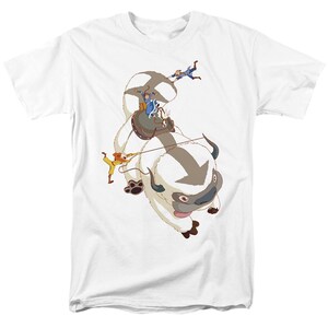 May include: White t-shirt with a graphic of a white furry creature with horns, a group of people riding on its back, and the text "Appa" in a blue box.