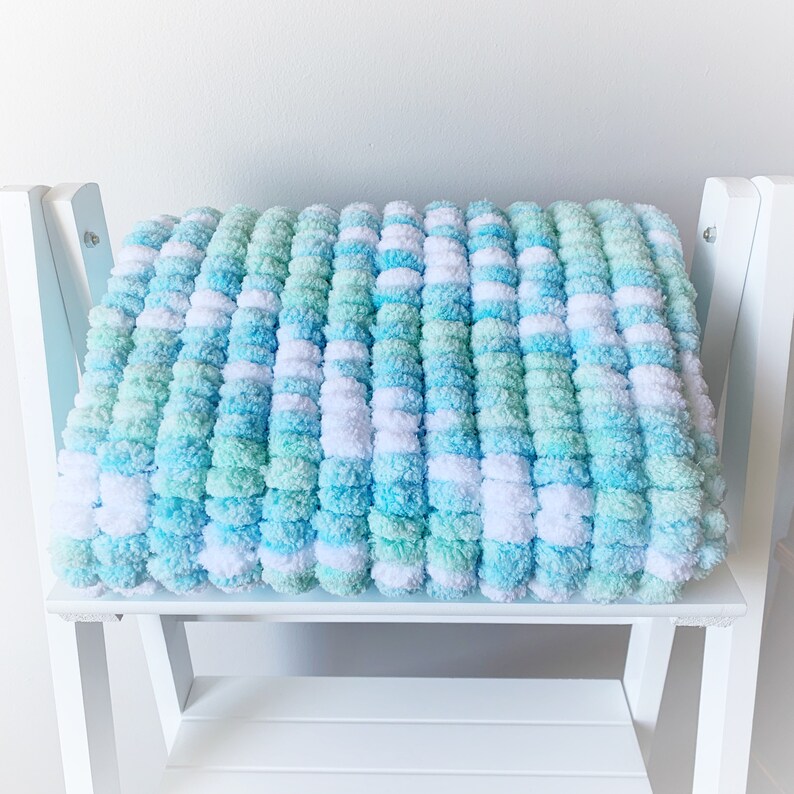 Soft knitted aqua Pom Pom pram size baby blanket accessory Etsy
