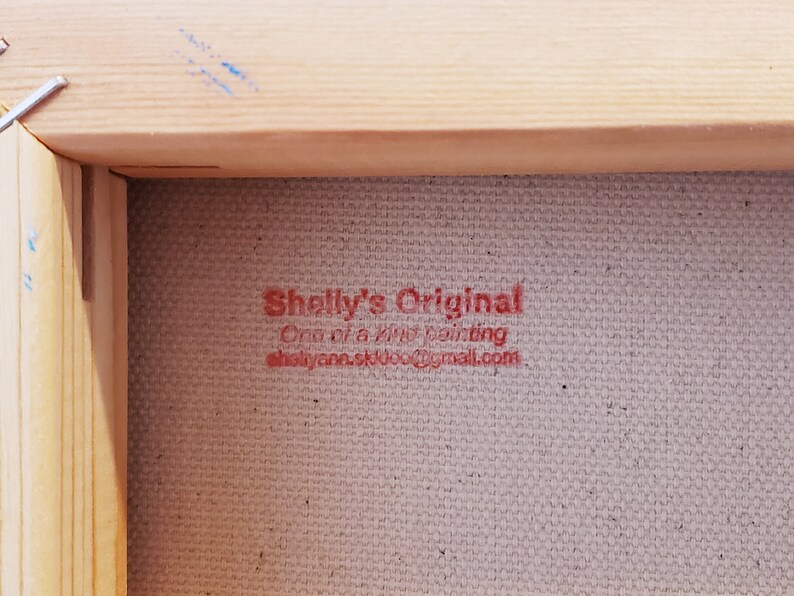 May include: Close-up of a red stamp on a canvas surface that reads "Shelly's Original One of a kind painting shellyannaskul@gmail.com"