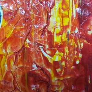 May include: Abstract painting with a textured surface. The painting features a mix of red, yellow, and white paint.