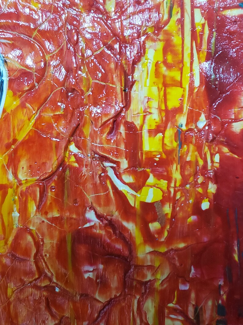 May include: Abstract painting with a textured surface. The painting features a mix of red, yellow, and white paint.