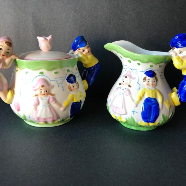 Vintage Sugar and Creamer with Duch Boy and Girl and Windmill on back