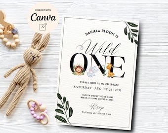May include: A white invitation with green foliage and animal illustrations. The text reads "Daniela Bloom is Wild One. Please join us to celebrate Saturday August 23, 2PM. 1 South County Road Palm Beach, FL 33480 United States. Rsvp to Emma at (555) 867-5309."